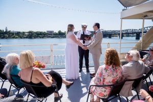 Portland Spirit | Intimate Wedding | Photo by CrystalGenesPhotography Couple gets married on boat by captain in front of a small number of guests.